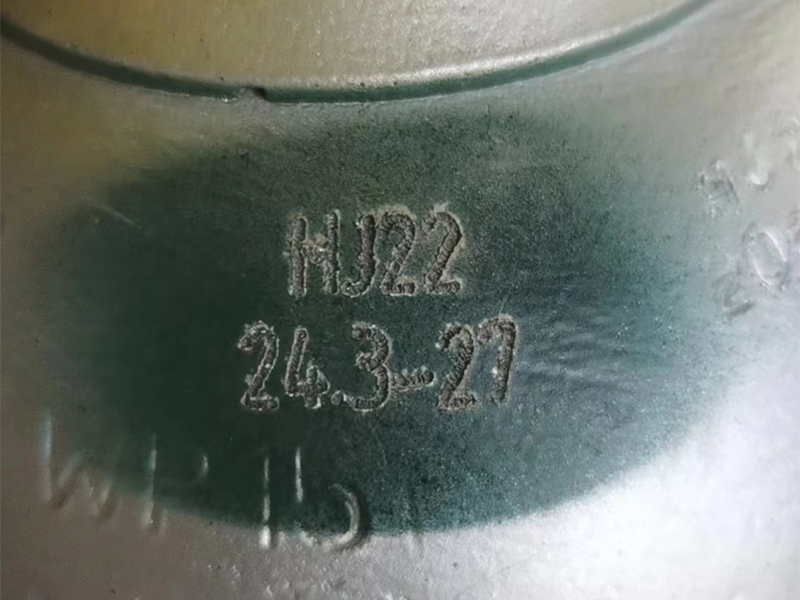 Close-up of pneumatic cylinder marking