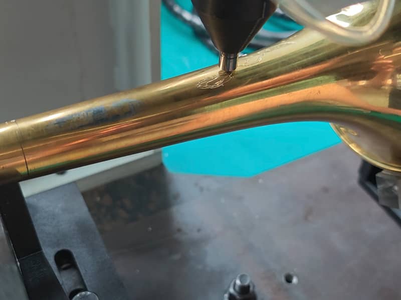 Personalize marking on a copper trumpet