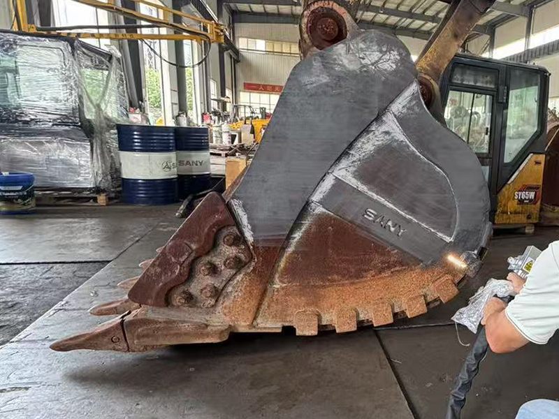 3000W CW laser cleaner being tested at SANY Group for paint removal on construction equipment parts