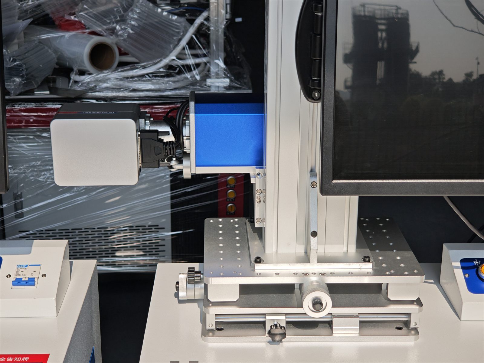 Desktop fiber laser marking system installed at customer production site for side marking