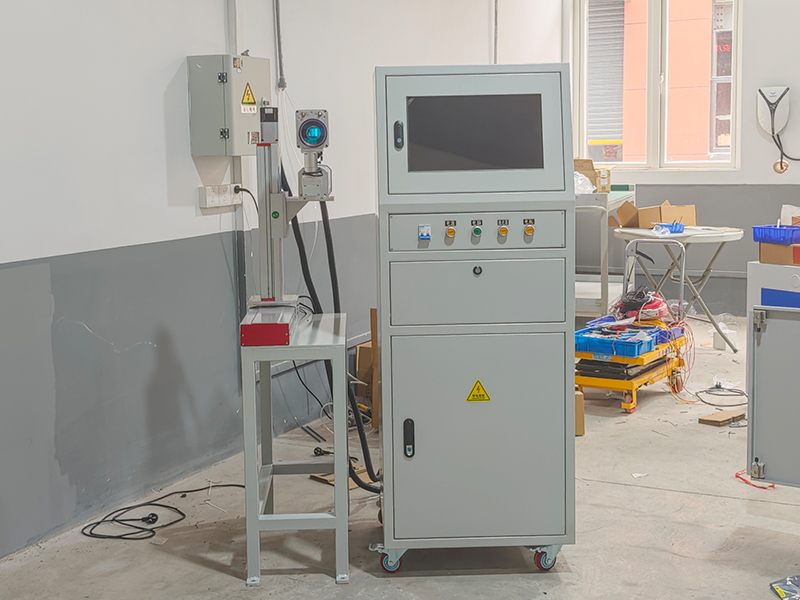 Automated laser marking machine on production line with PLC control