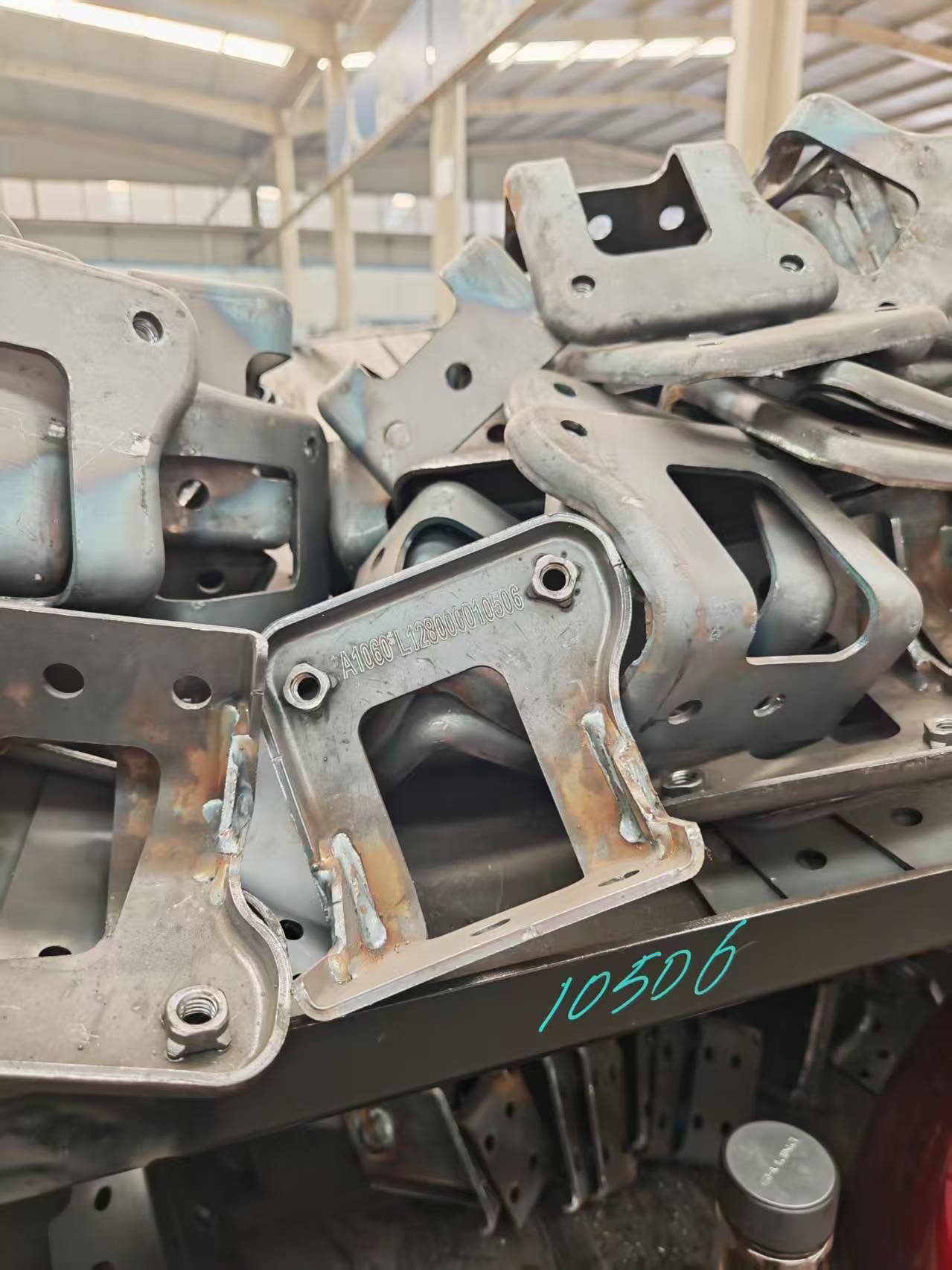 Cast automotive chassis structural component used as an application example for permanent marking