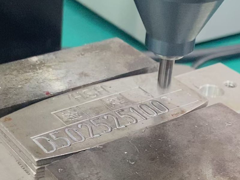 Scribe marking on a metal infrastructure tag