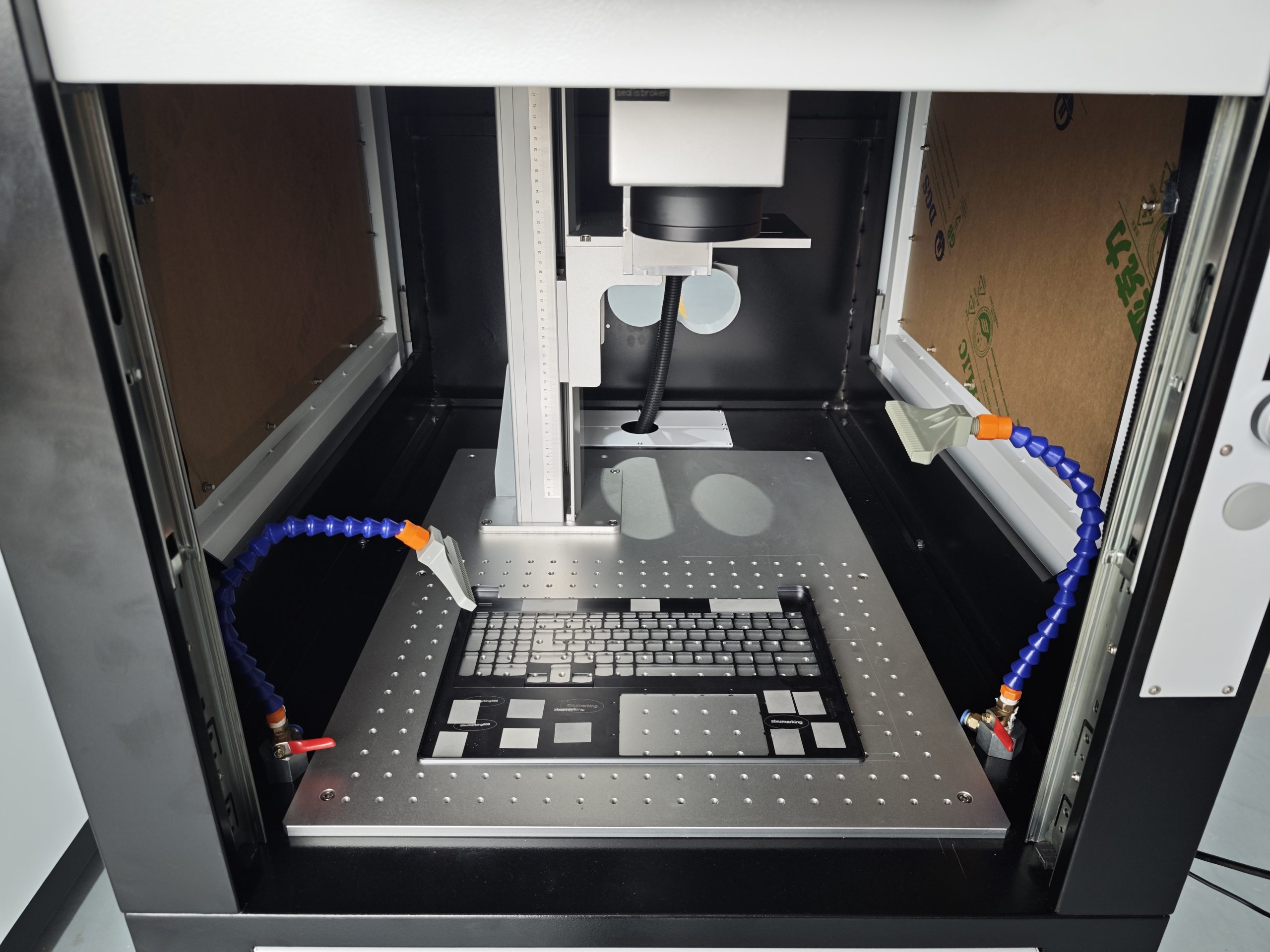 Laser anodizing removal system with enclosed cabinet and fume extraction