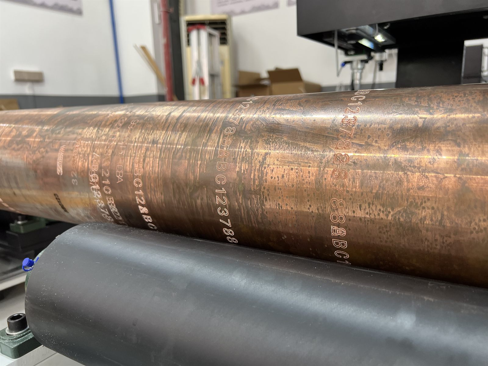 Close-up of permanent identification marked on an ultra-hard oil drill pipe surface