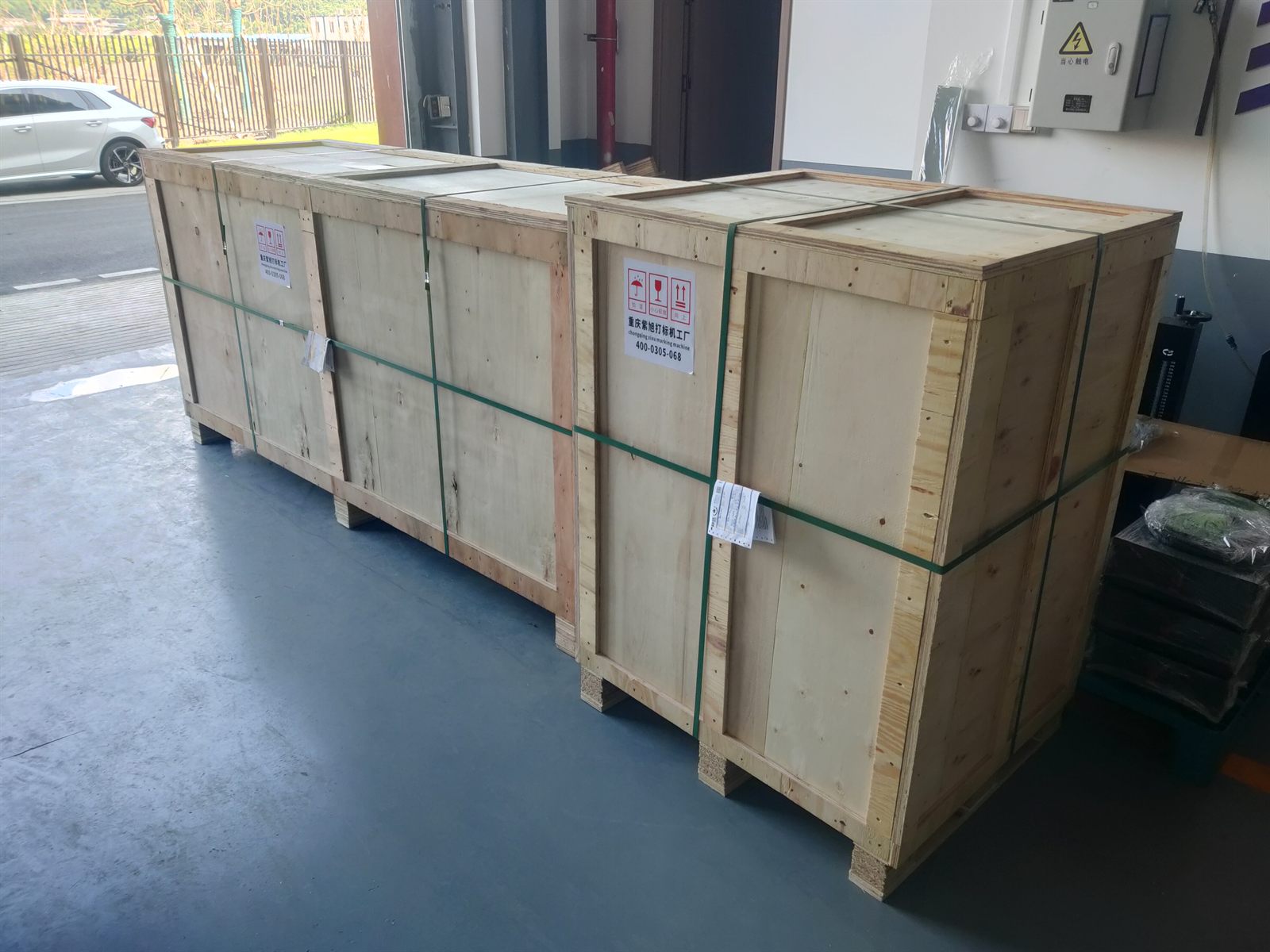 Wooden export crates prepared for delivery of the custom oil drill pipe dot peen marking system