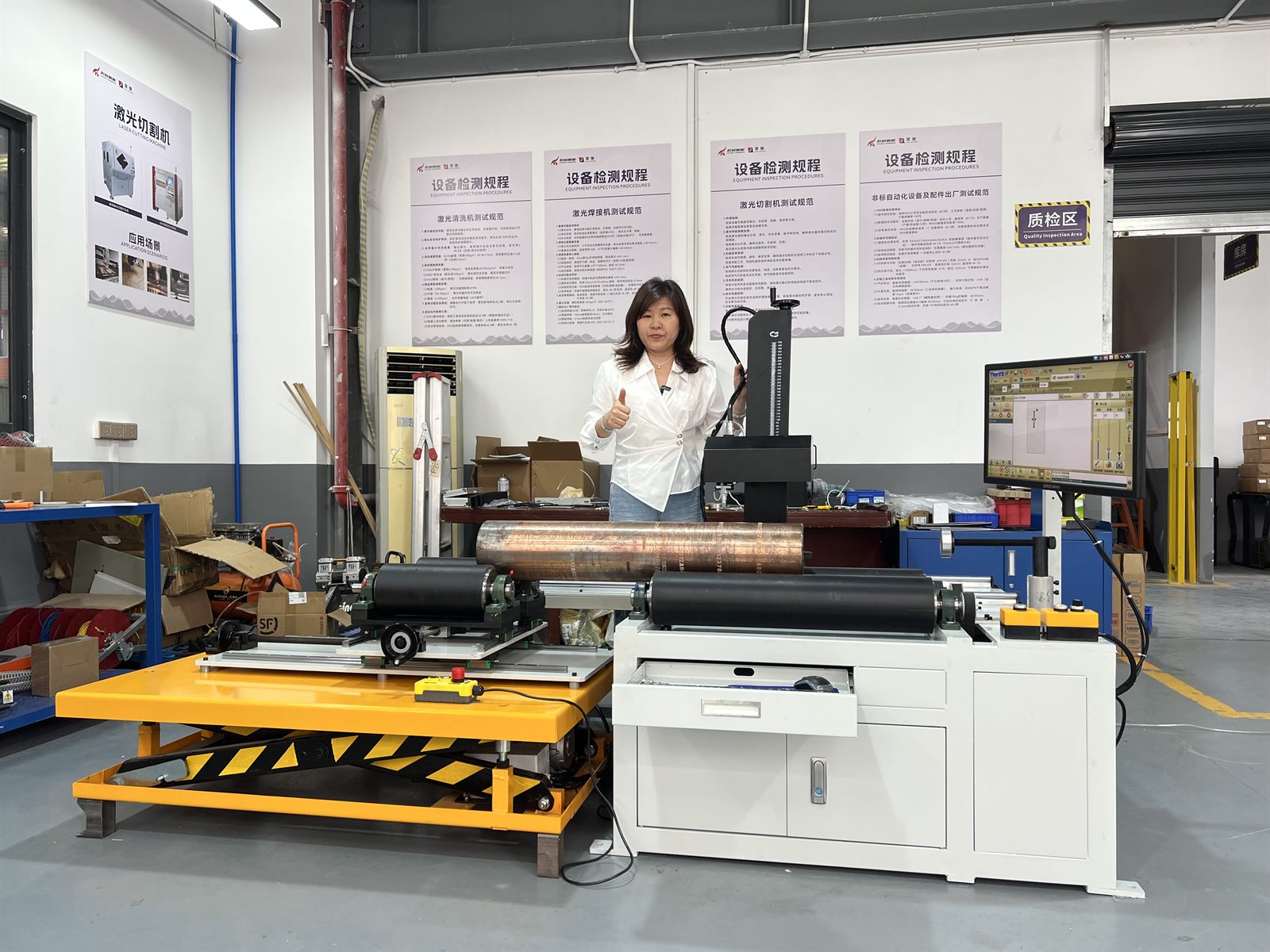Factory acceptance photo showing the completed oil drill pipe dot peen marking workstation and supported workpiece