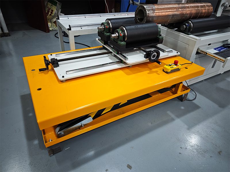 Split lifting bench detail on the passive side of the oil drilling rod rotary dot peen workstation