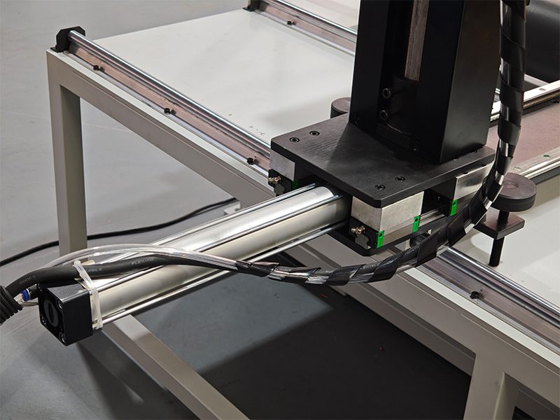 Marking head mounted on the long-travel slide of the custom oil drilling rod dot peen workstation