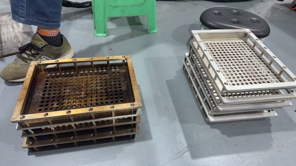 Before-and-after view of used semiconductor reflow carrier trays prepared for laser cleaning sample evaluation