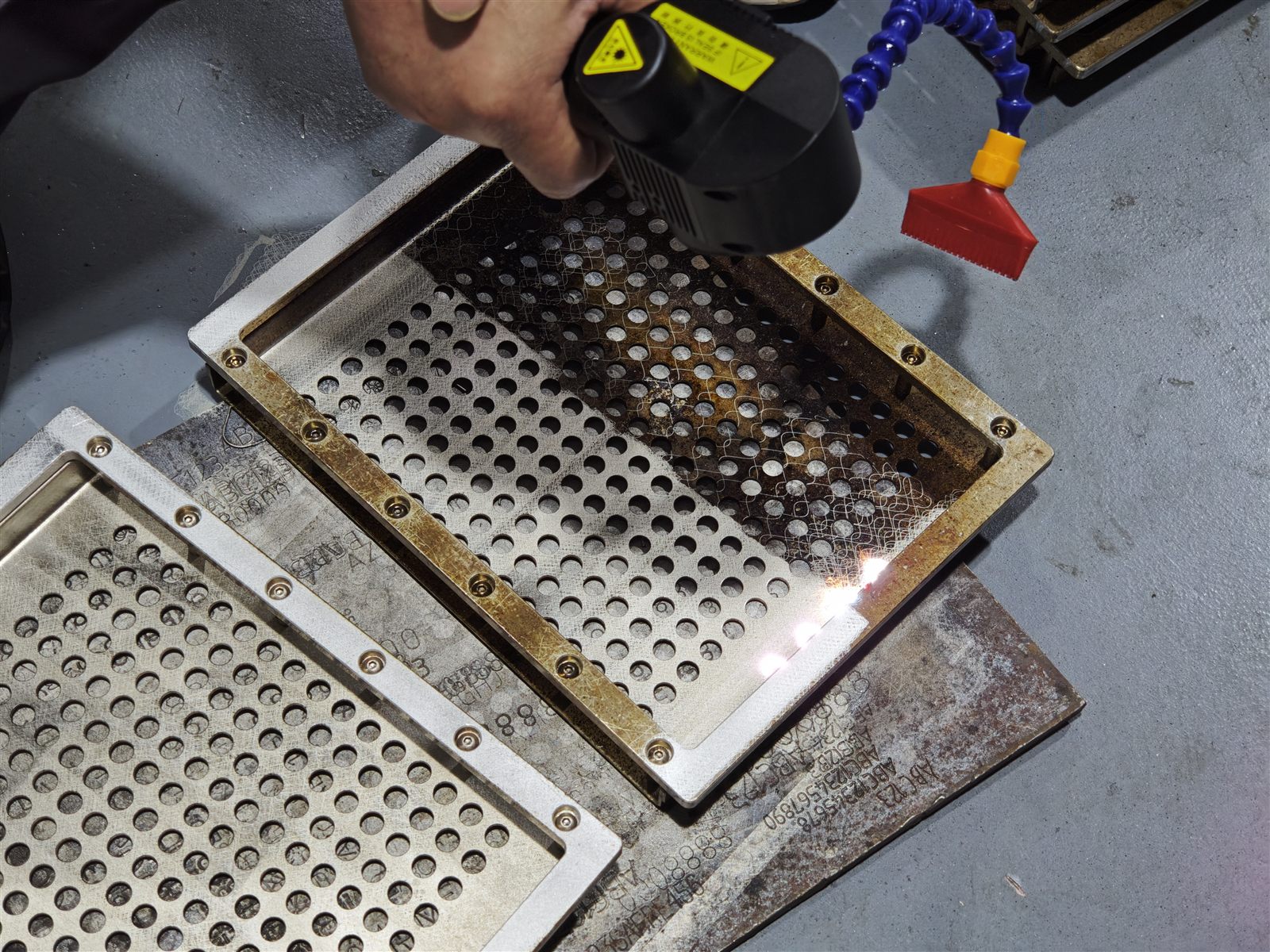 Cleaned carrier tray surface after laser cleaning sample evaluation