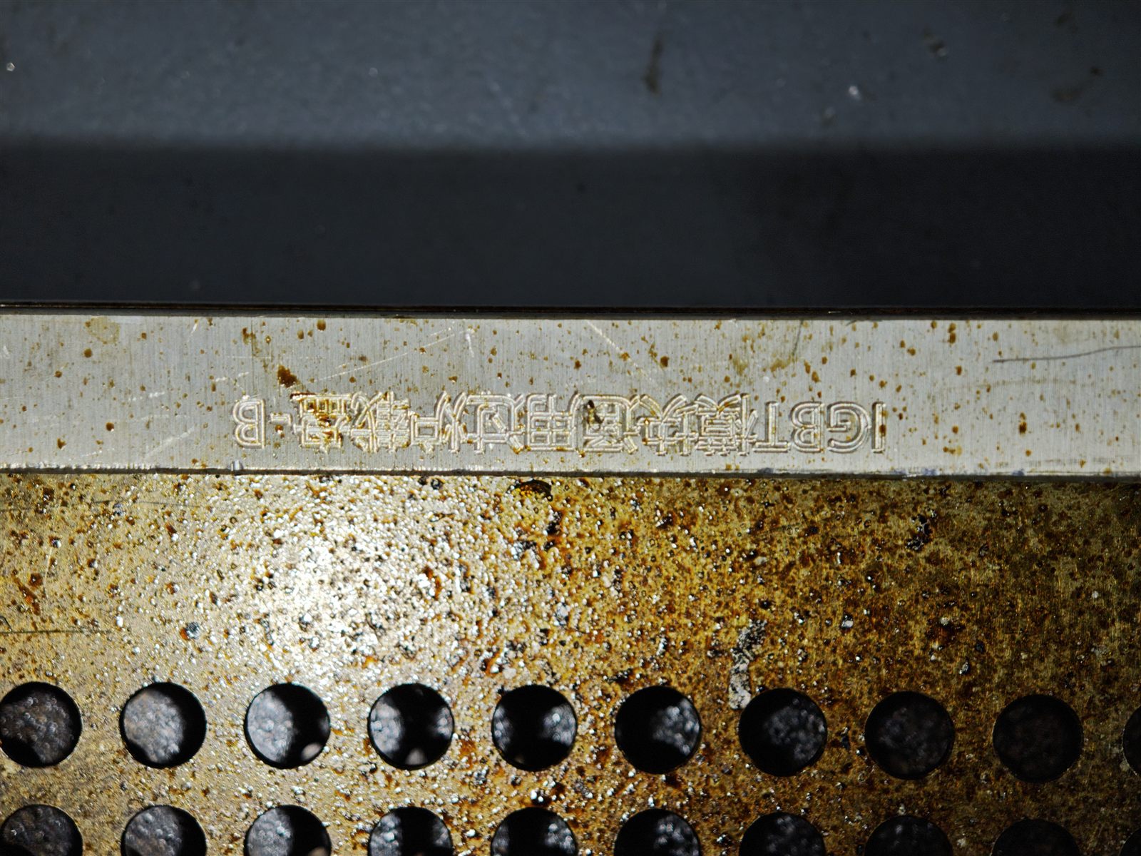 Semiconductor process carrier tray sample after pulsed laser cleaning test