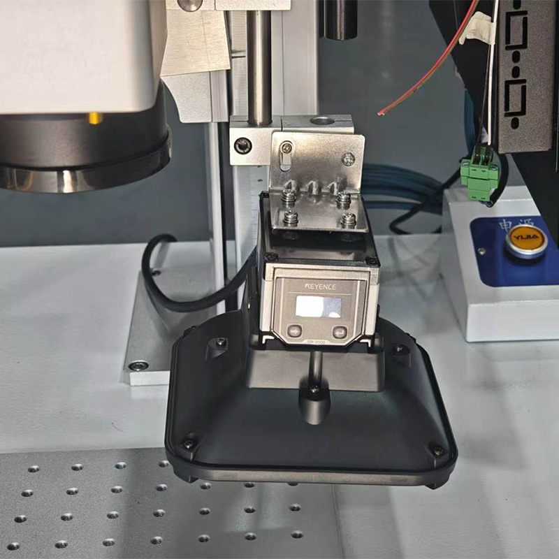 Close-up of integrated scanner and laser marking head