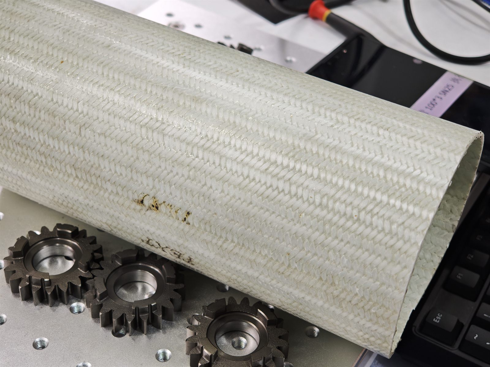 Glass fiber tube surface before fiber laser marking test at ZiXu workshop