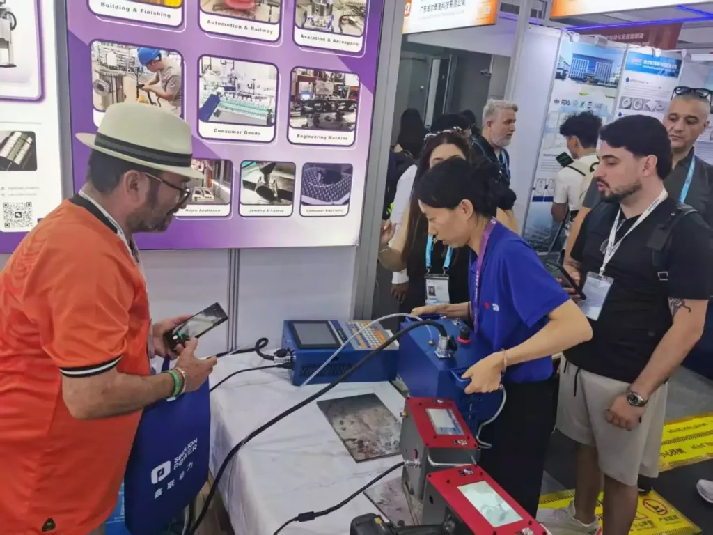 A visitor films the live marking demonstration at the ZIXU booth.