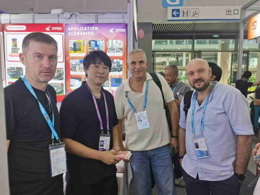 Buyers handling the handheld marking unit at Booth 20.1G21
