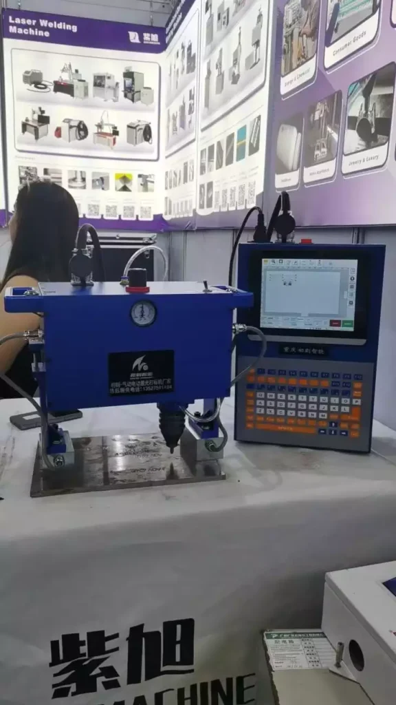 The dot peen marking machine and its control unit on display at the fair.